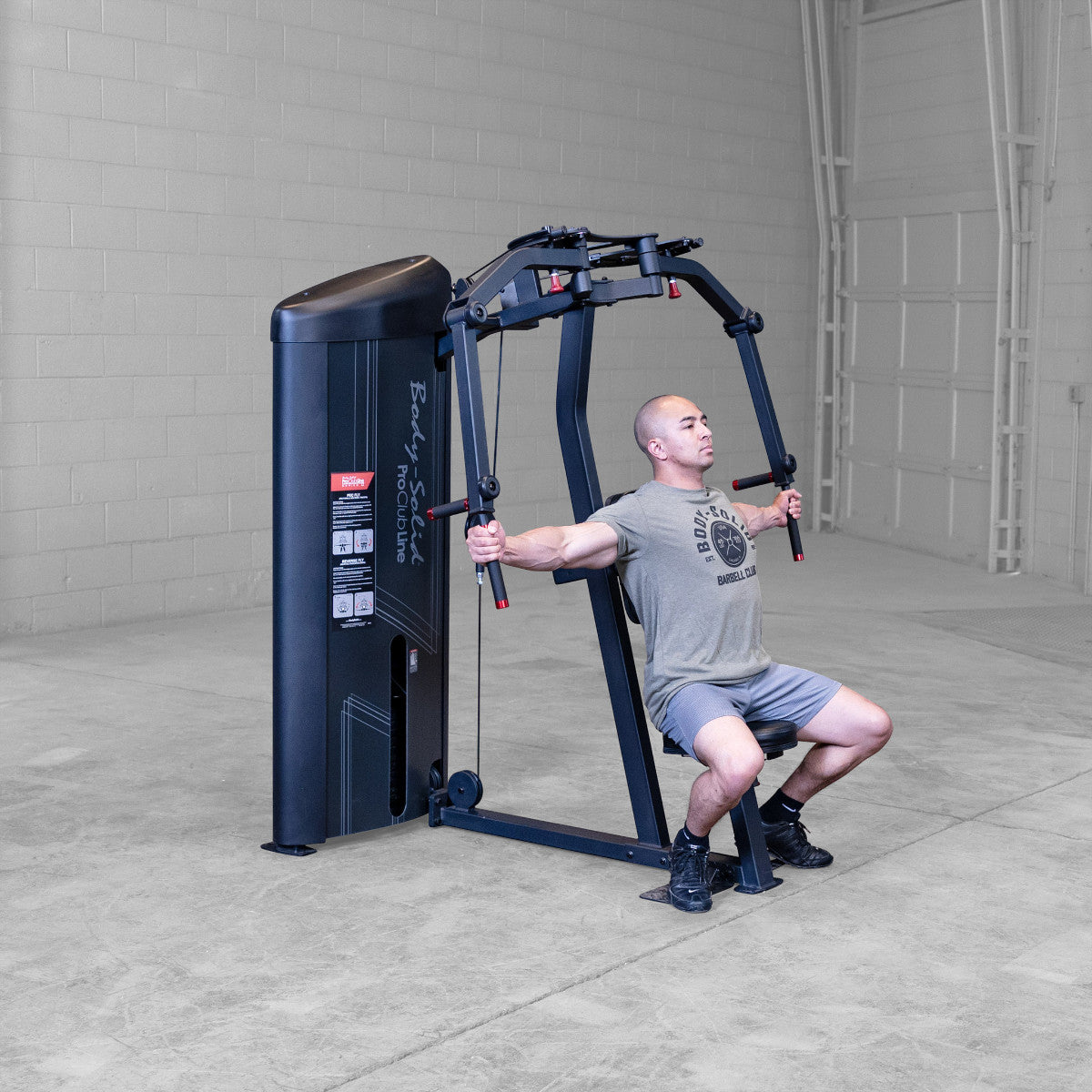Body-Solid S2PECX Pro ClubLine Series 2 Dual Pec Fly & Rear Delt Machine in gym with man exercising