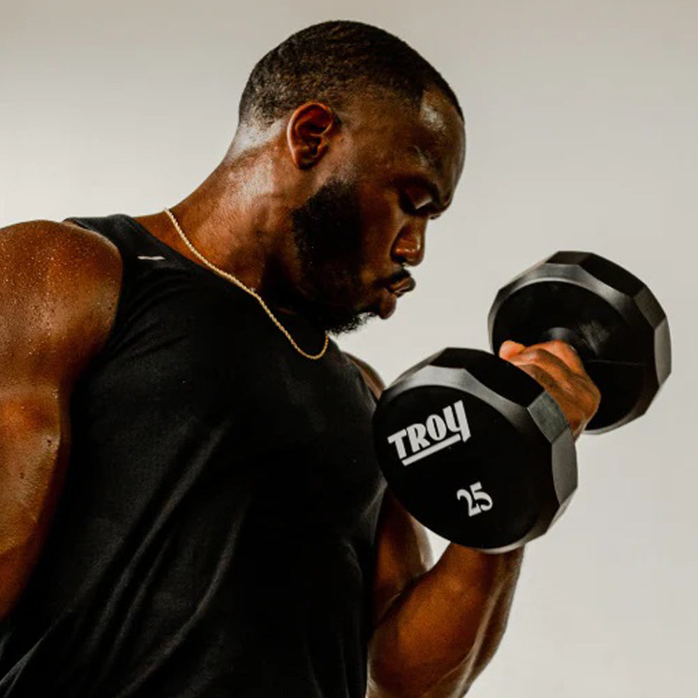 Troy Barbell TSD-U Urethane Encased 25lb Dumbbells curls.
