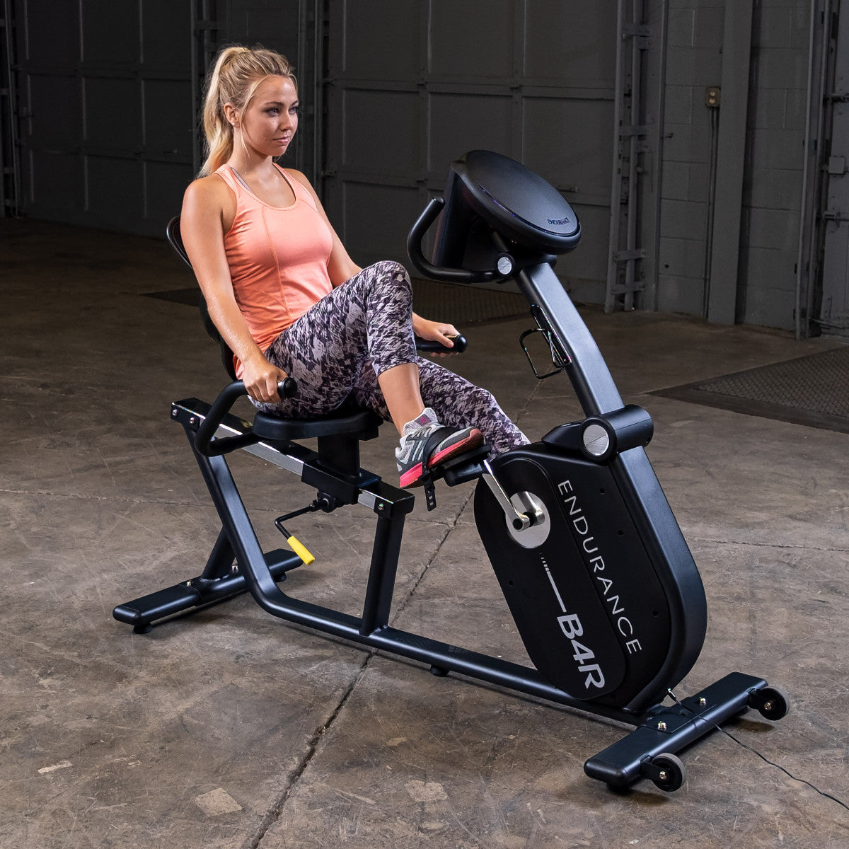 Body-Solid Endurance B4RB Recumbent Bike woman exercising
