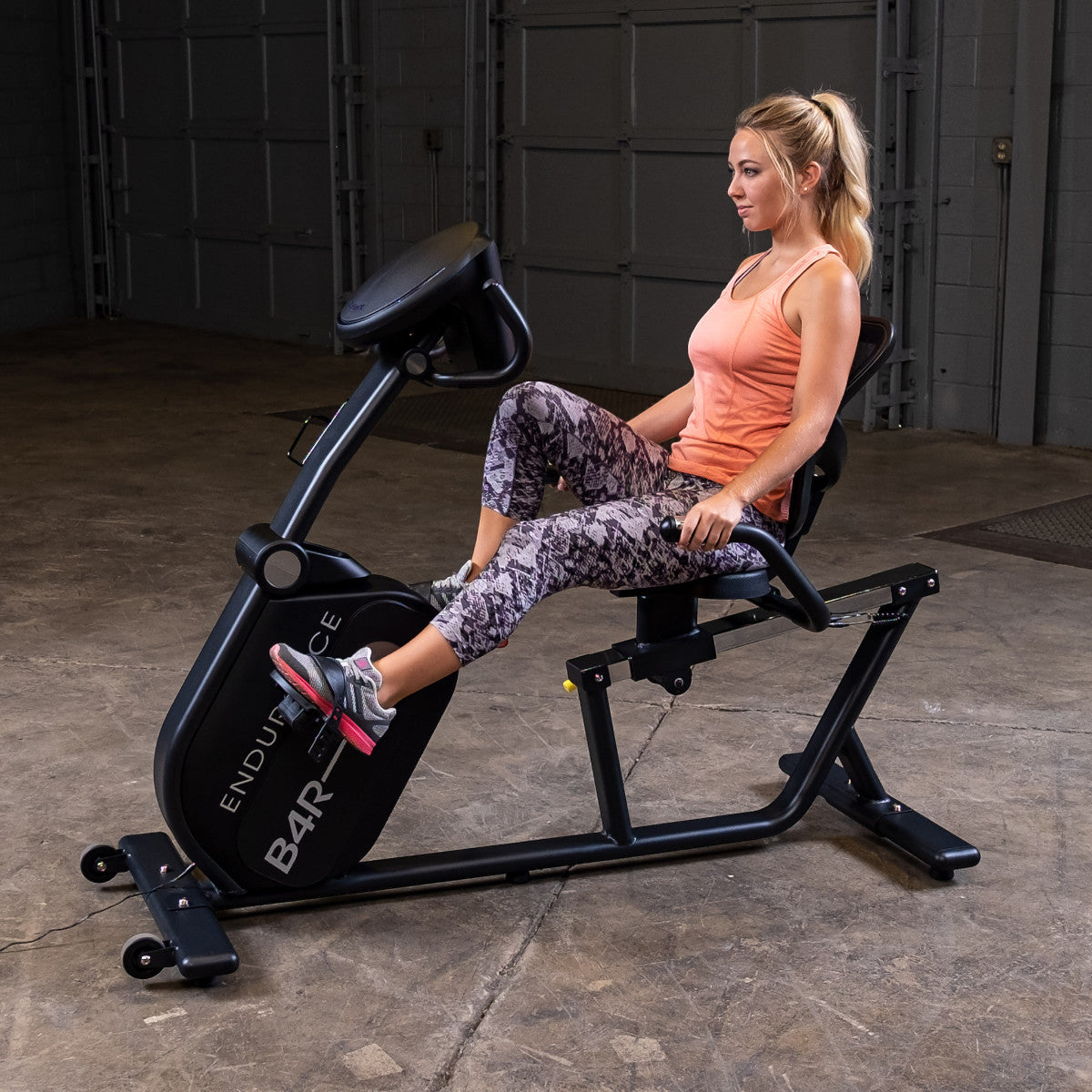 Body-Solid Endurance B4RB Recumbent Bike woman exercising