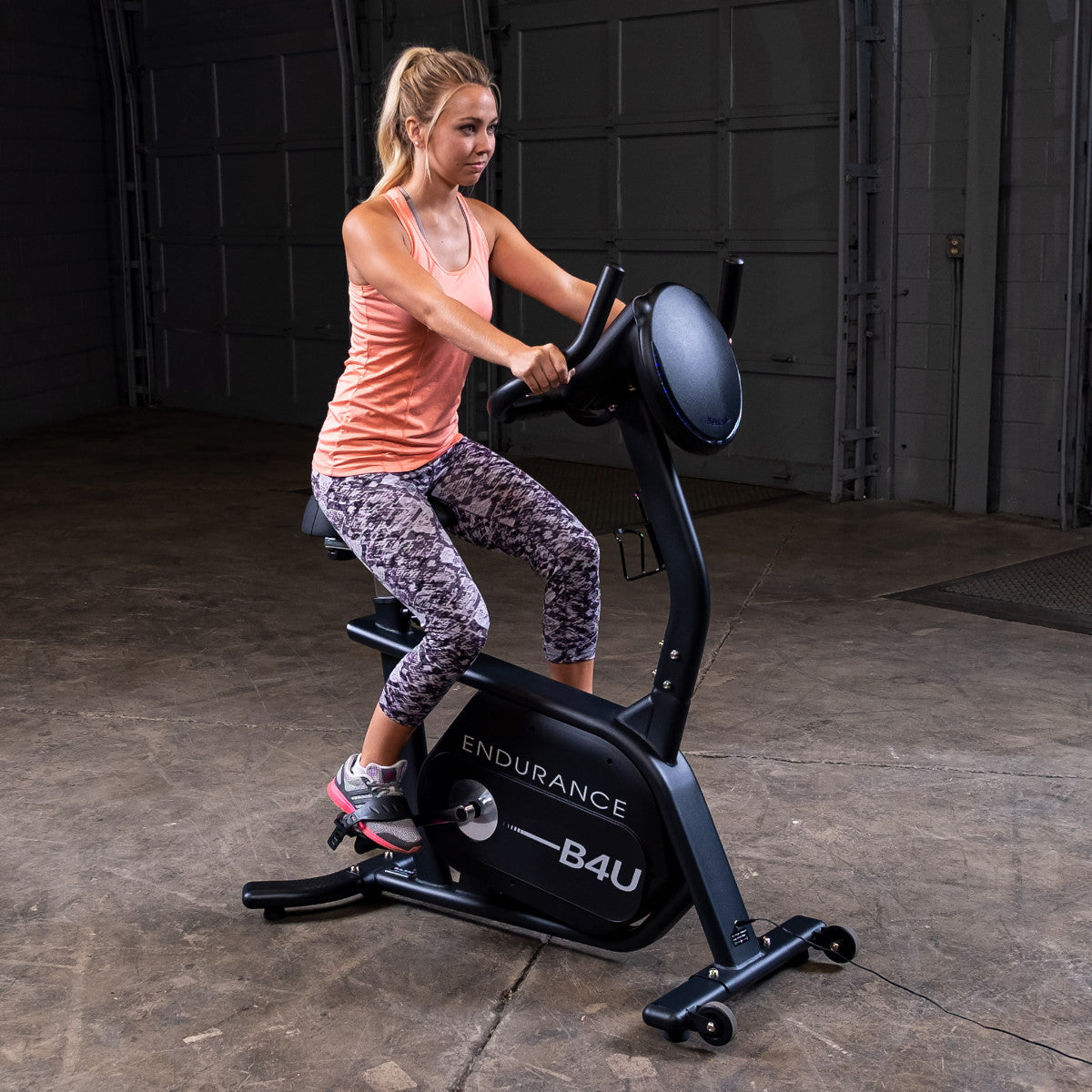 Body-Solid Endurance B4UB Upright Bike with woman riding
