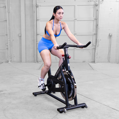 Body-Solid Best Fitness BFSB5B Indoor Training Cycle woman riding