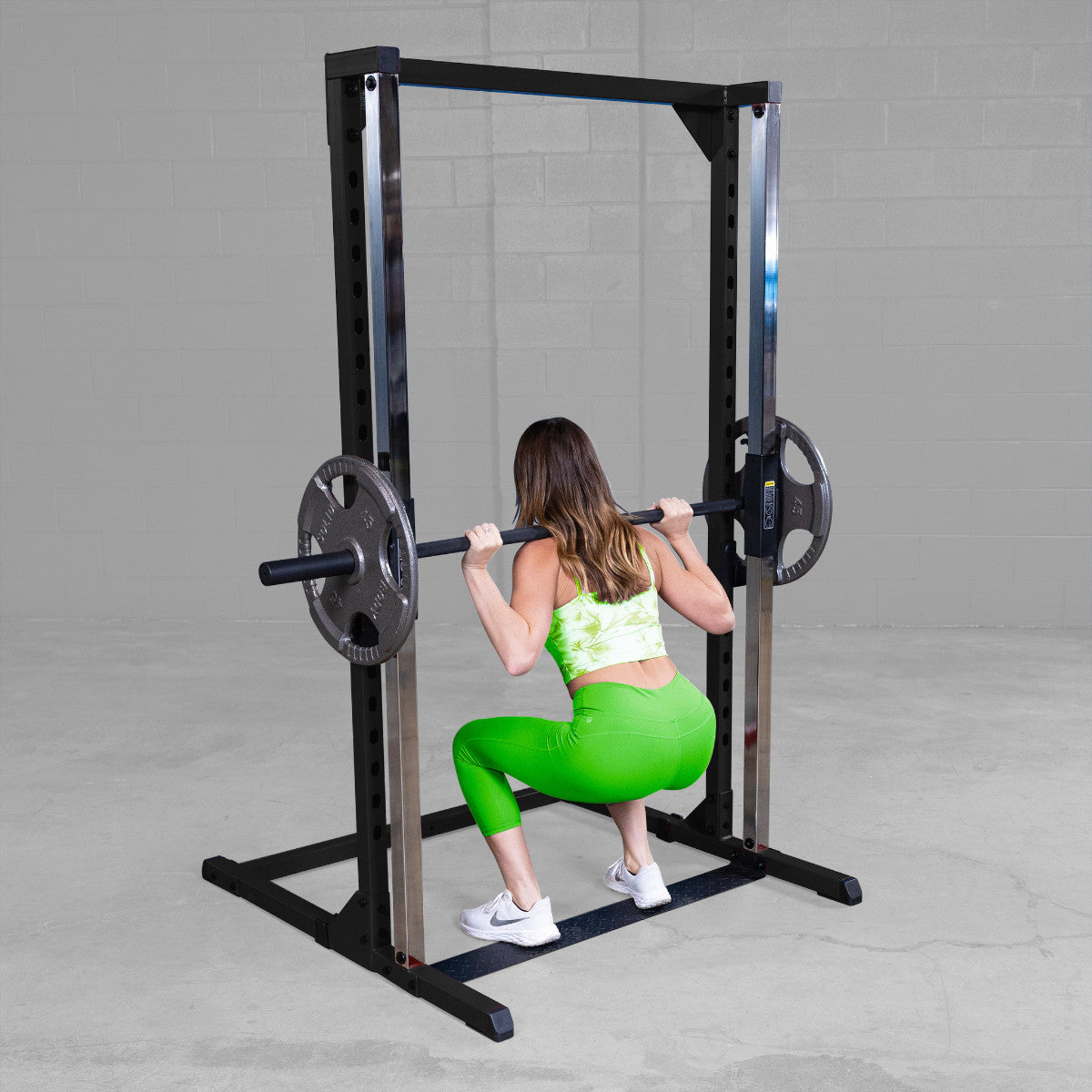 Body-Solid BFSM250B Best Fitness Smith Machine woman exercising