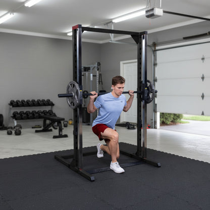 Body-Solid BFSM250B Best Fitness Smith Machine man exercising in garage gym