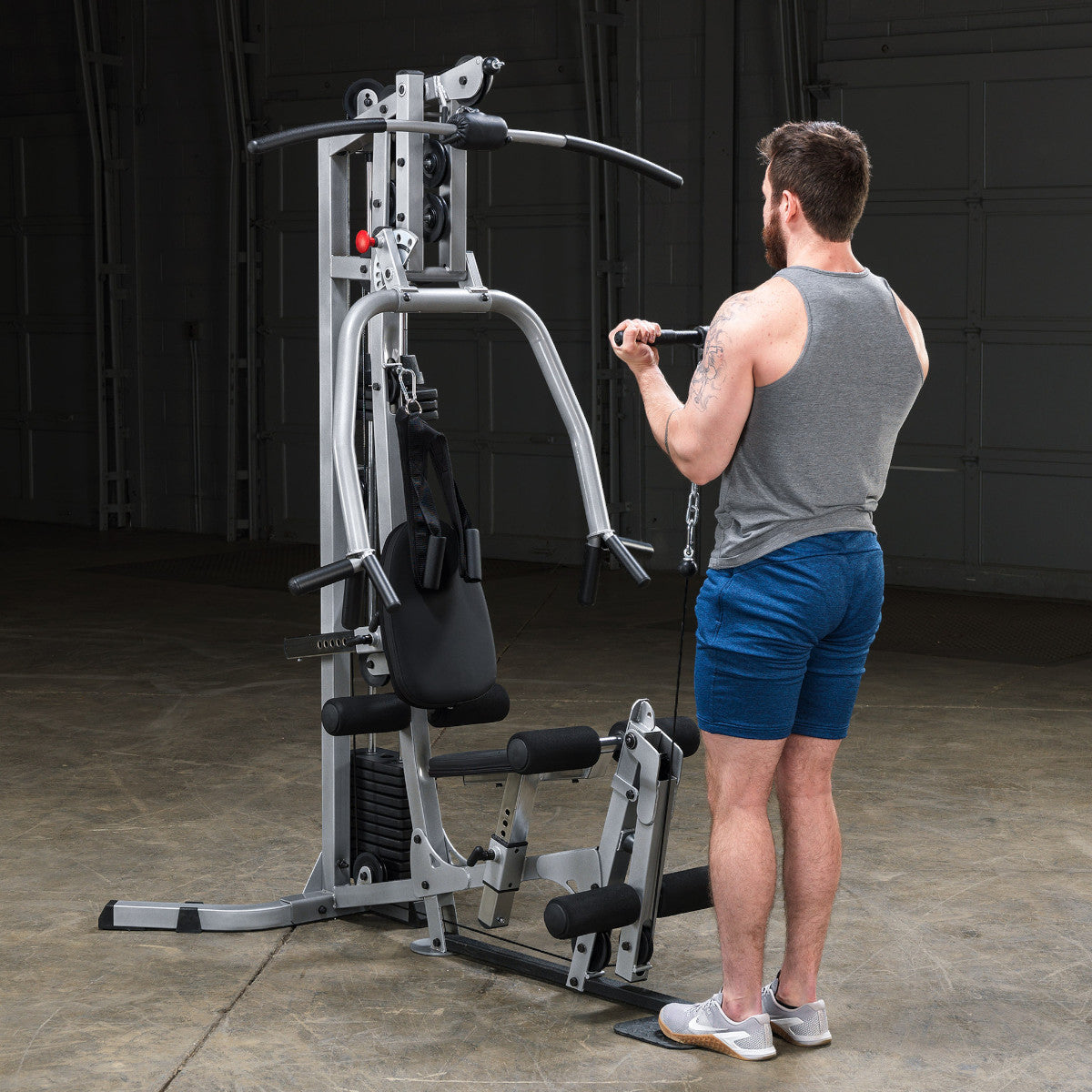 Body-Solid Powerline BSG10X Multi-Station Home Gym exercise