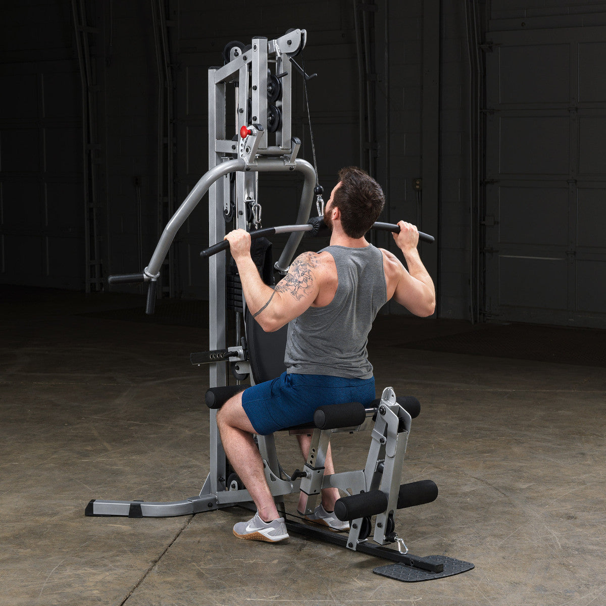 Body-Solid Powerline BSG10X Multi-Station Home Gym exercise