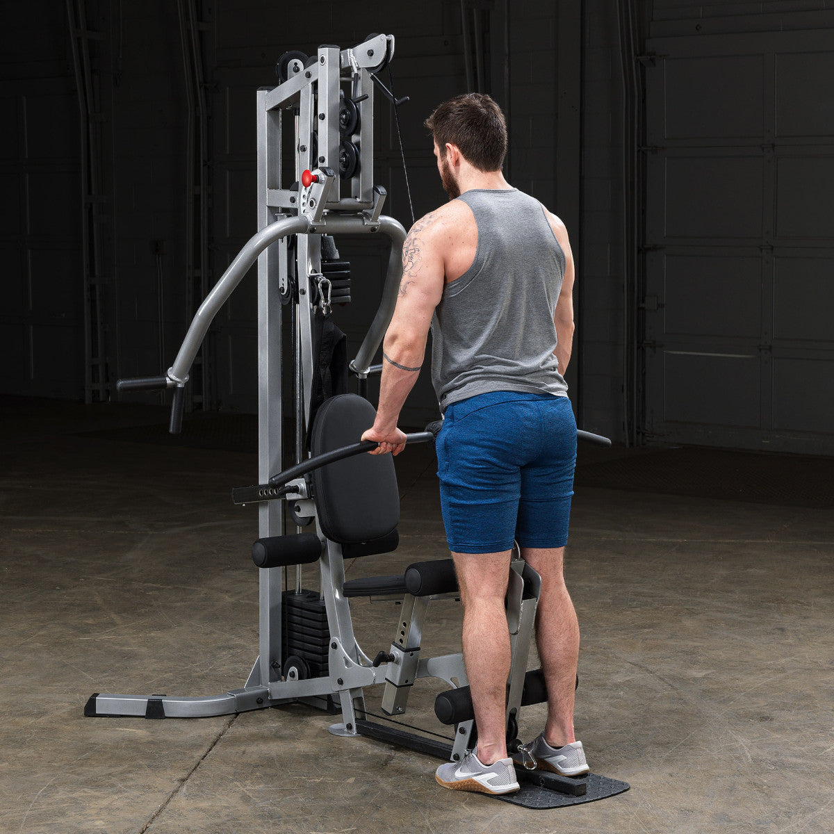 Body-Solid Powerline BSG10X Multi-Station Home Gym exercise