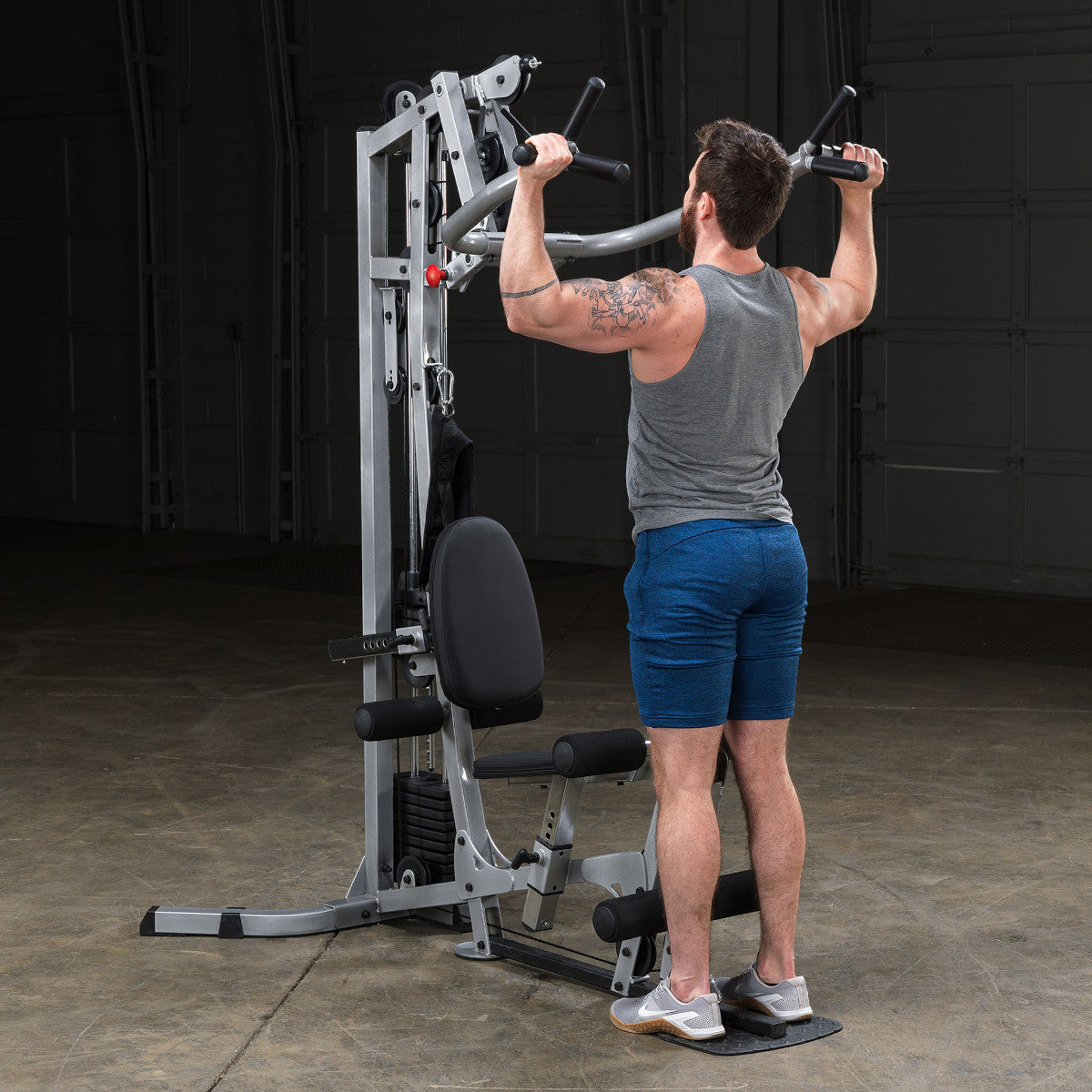 Body-Solid Powerline BSG10X Multi-Station Home Gym exercise
