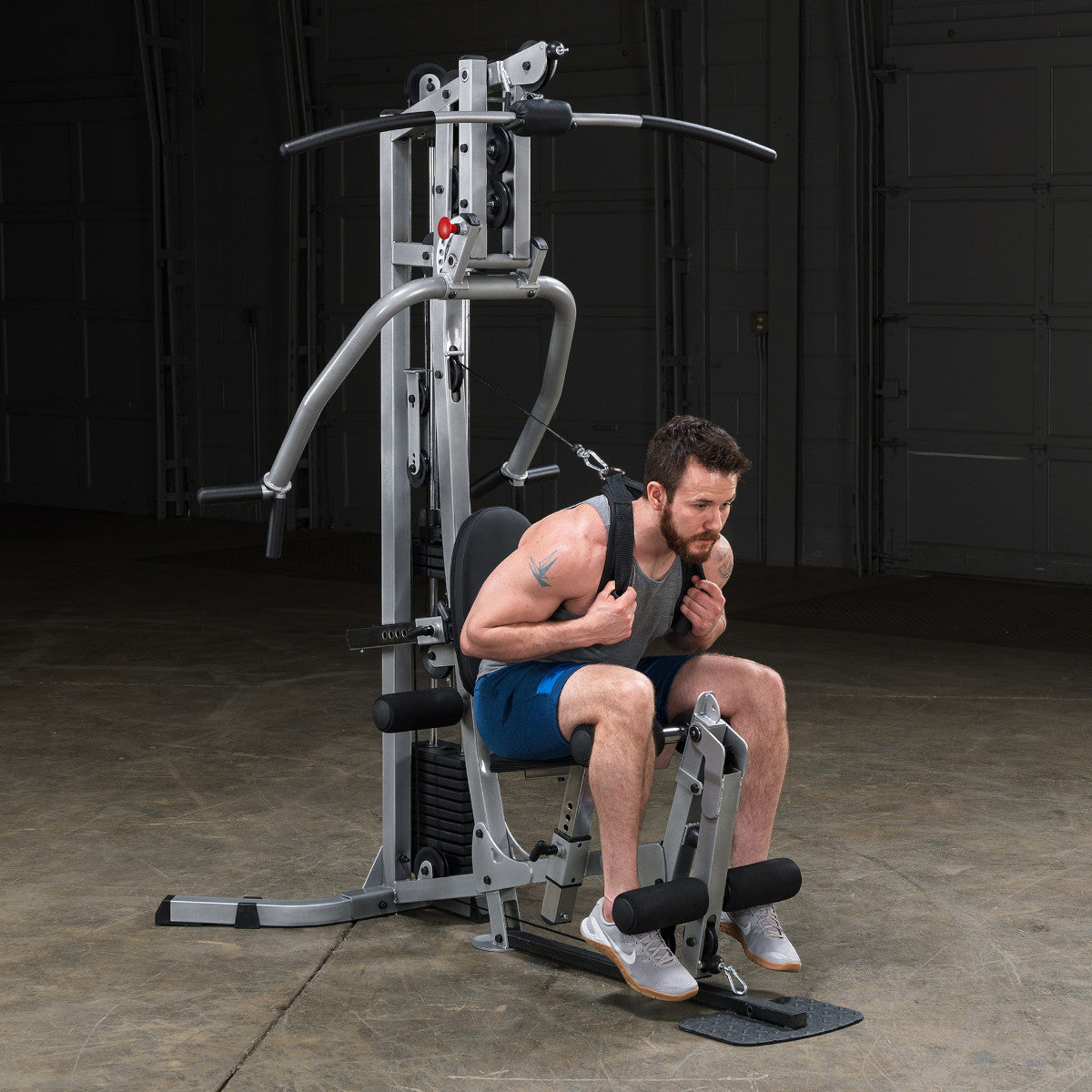 Body-Solid Powerline BSG10X Multi-Station Home Gym exercise