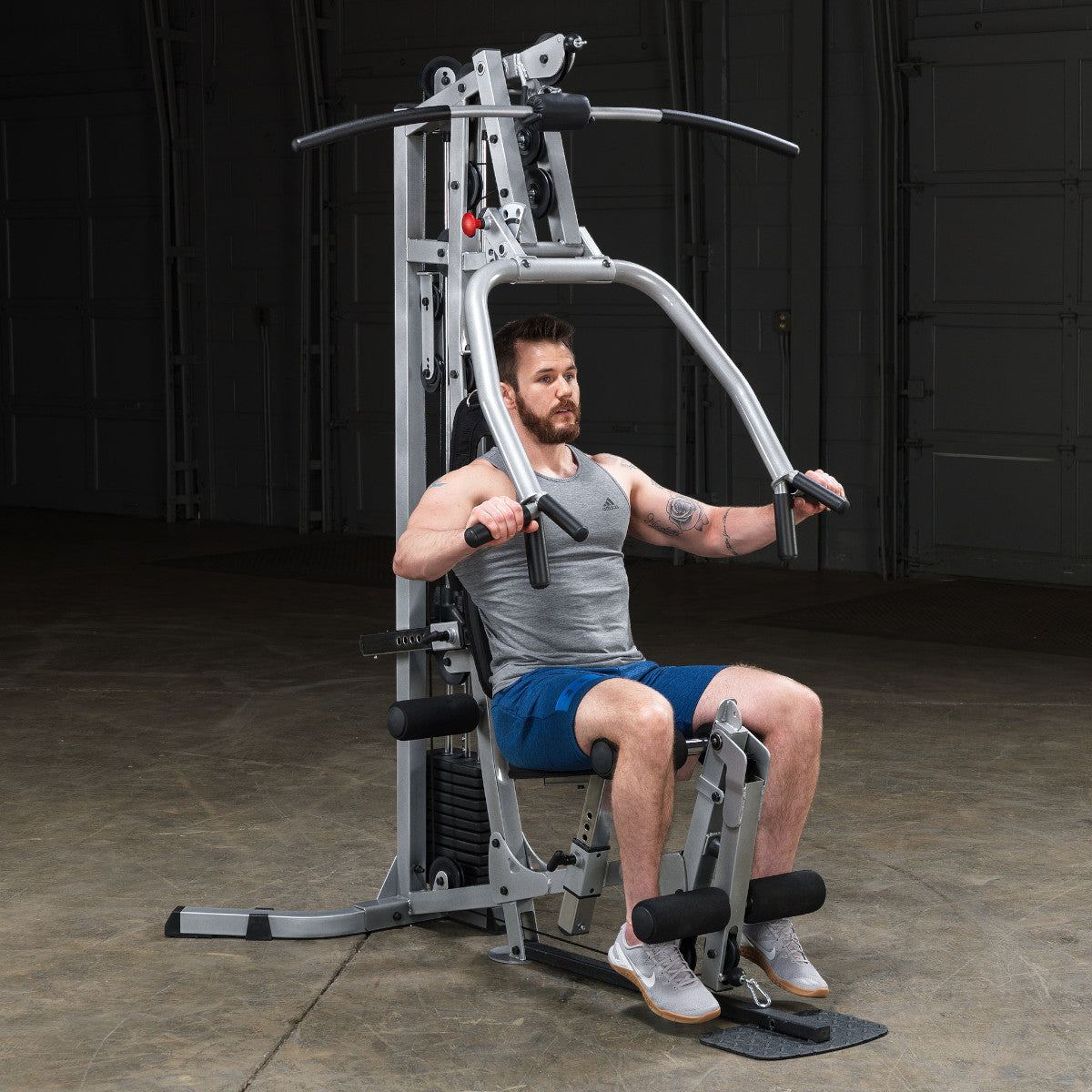Body-Solid Powerline BSG10X Multi-Station Home Gym exercise