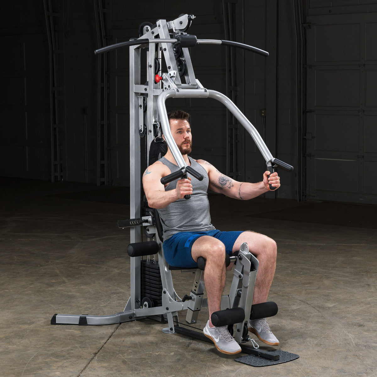 Body-Solid Powerline BSG10X Multi-Station Home Gym exercise