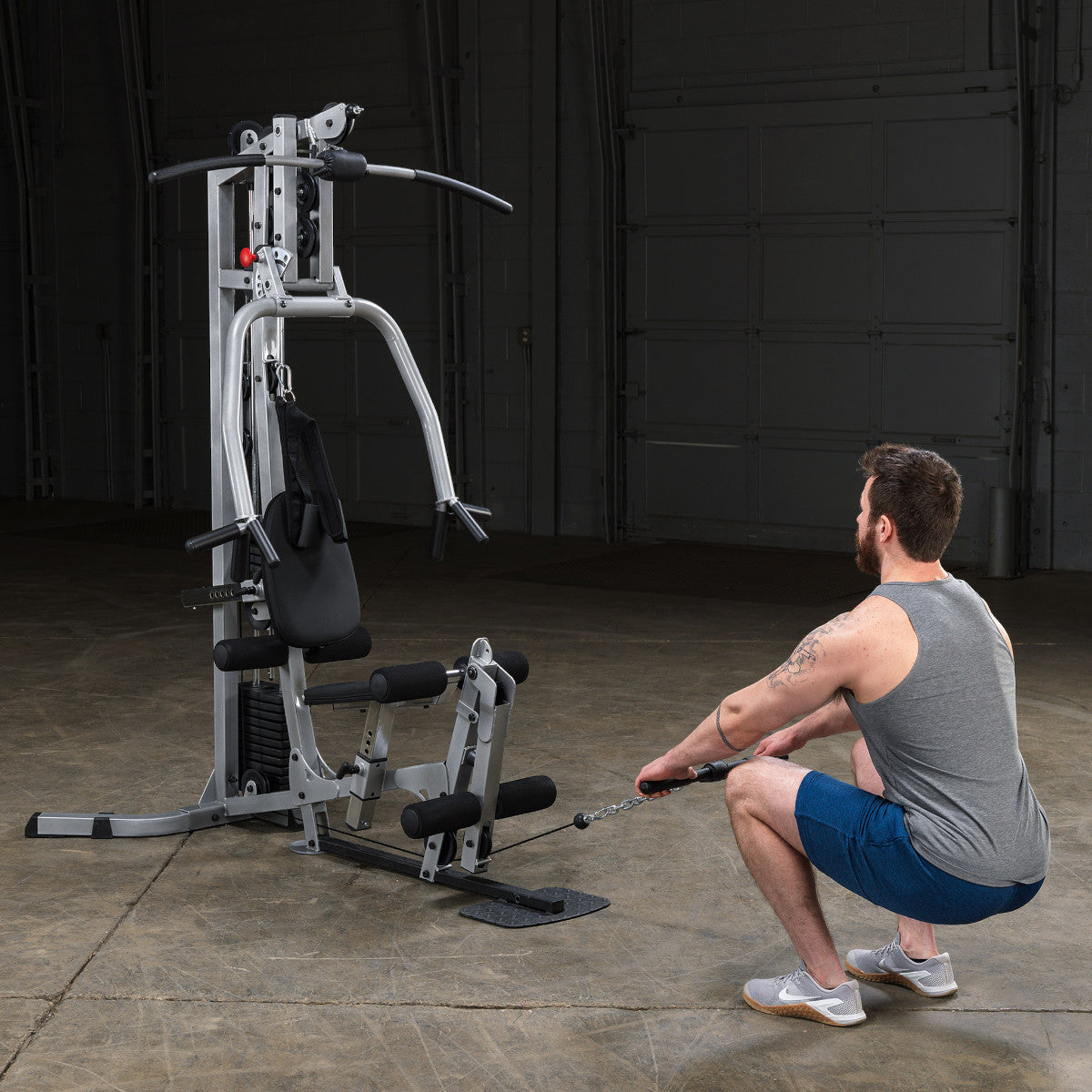 Body-Solid Powerline BSG10X Multi-Station Home Gym exercise