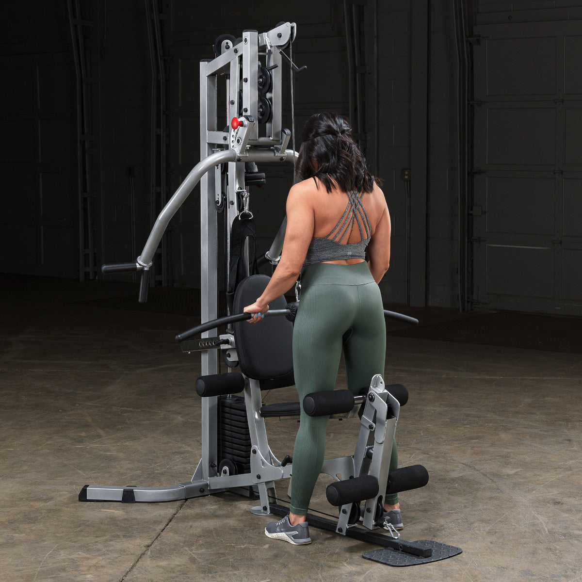 Body-Solid Powerline BSG10X Multi-Station Home Gym exercise