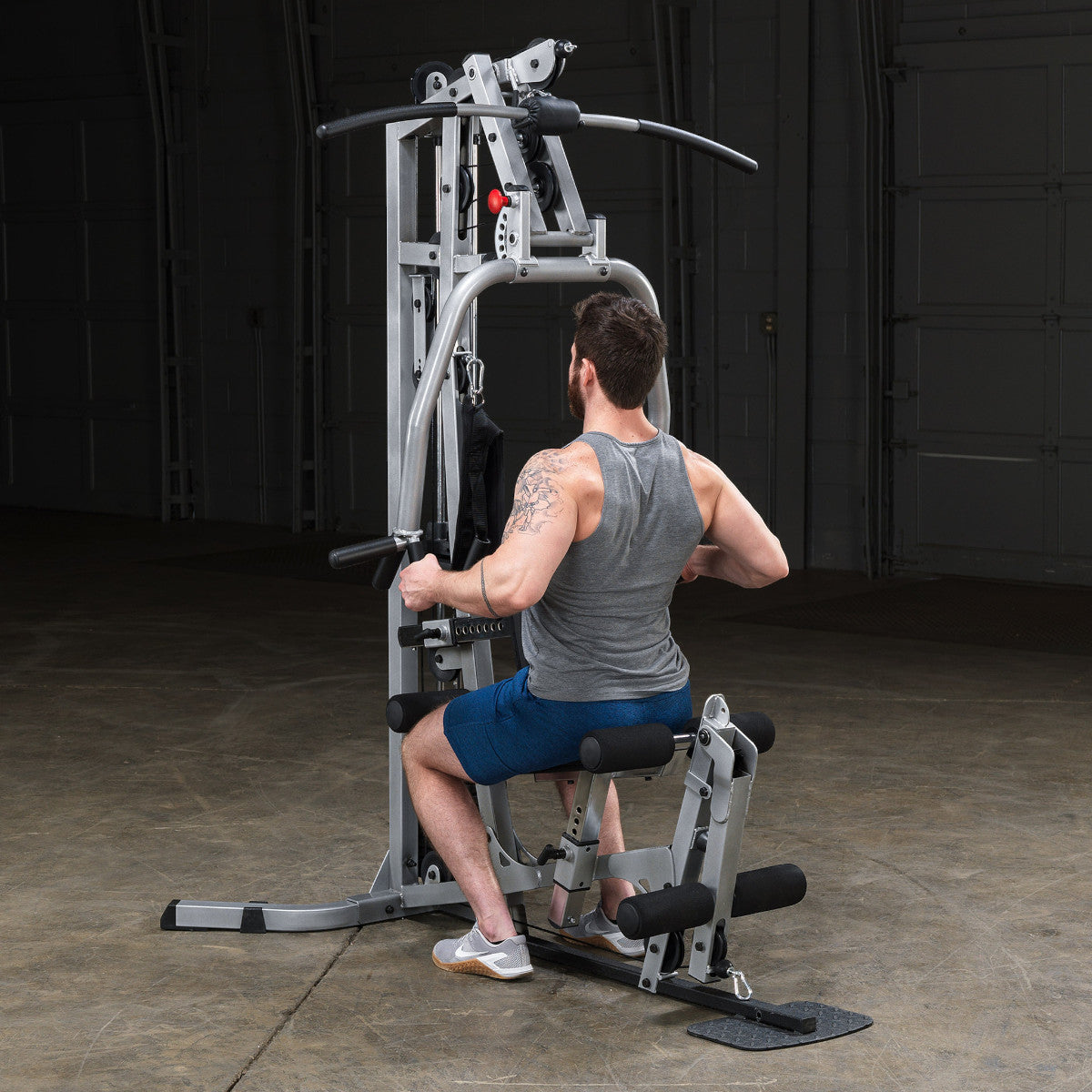 Body-Solid Powerline BSG10X Multi-Station Home Gym exercise