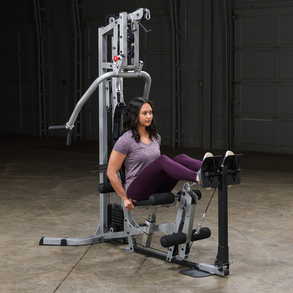 Body-Solid Powerline BSG10X Multi-Station Home Gym exercise