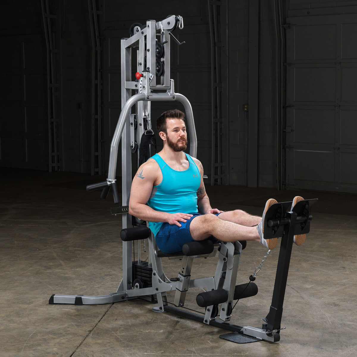 Body-Solid Powerline BSG10X Multi-Station Home Gym exercise
