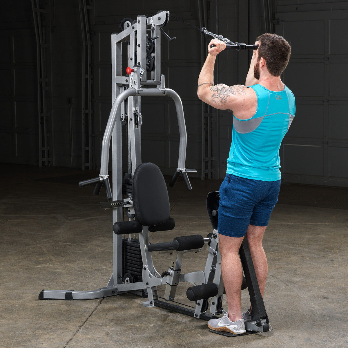 Body-Solid Powerline BSG10X Multi-Station Home Gym exercise