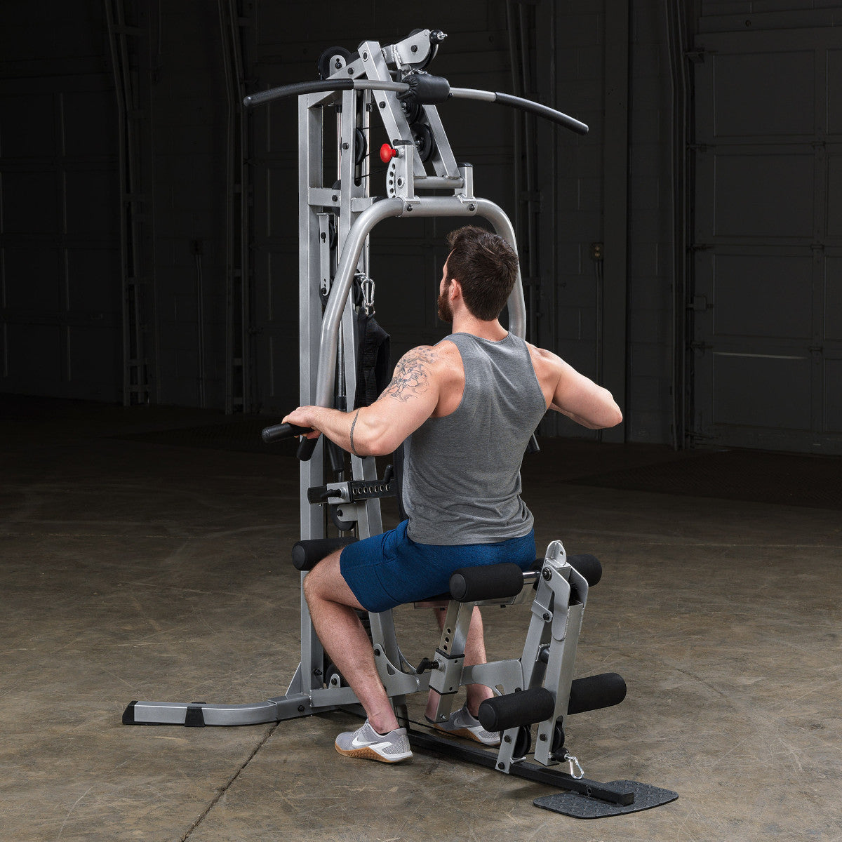 Body-Solid Powerline BSG10X Multi-Station Home Gym exercise