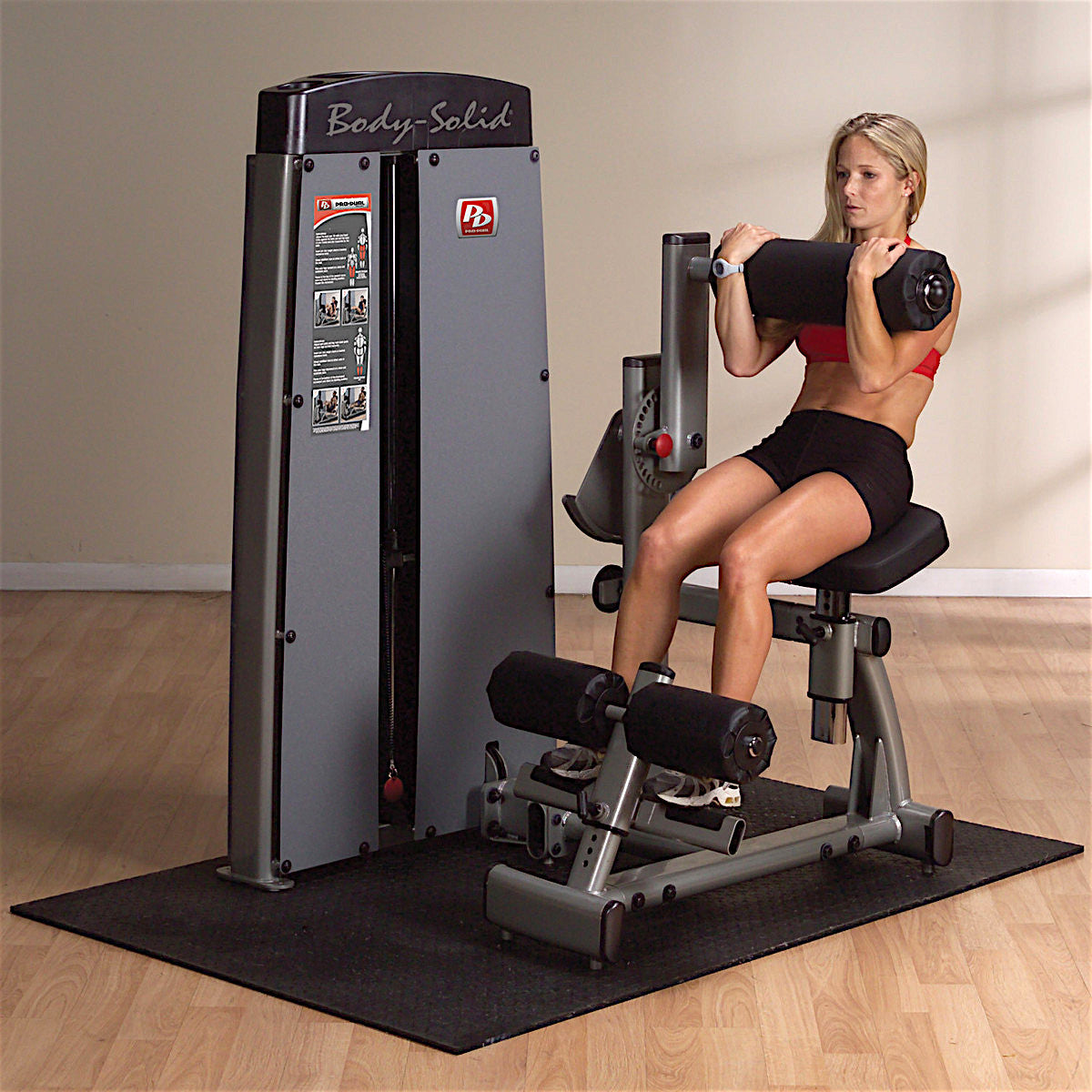 Body-Solid DABB ProDual Ab and Back Machine woman exercising