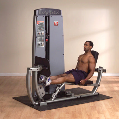 Body-Solid DCLPSF ProDual Leg Calf Press Machine in room with man exercising