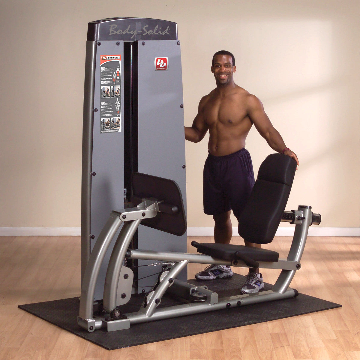 Body-Solid DCLPSF ProDual Leg Calf Press Machine in room with man