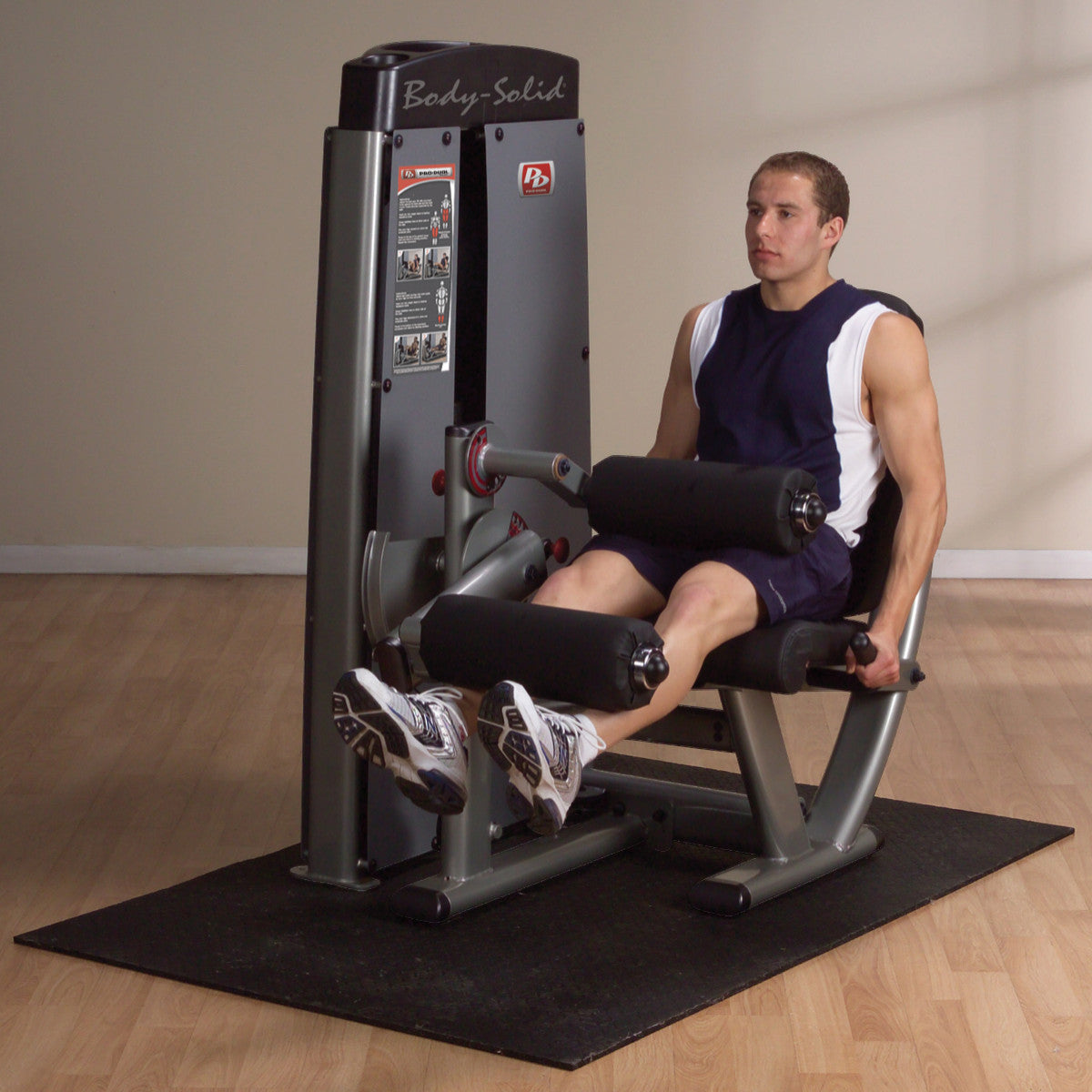 Body-Solid DLECSF ProDual Leg Extension Curl Machine with man exercising