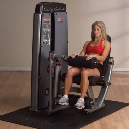 Body-Solid DLECSF ProDual Leg Extension Curl Machine with woman exercising