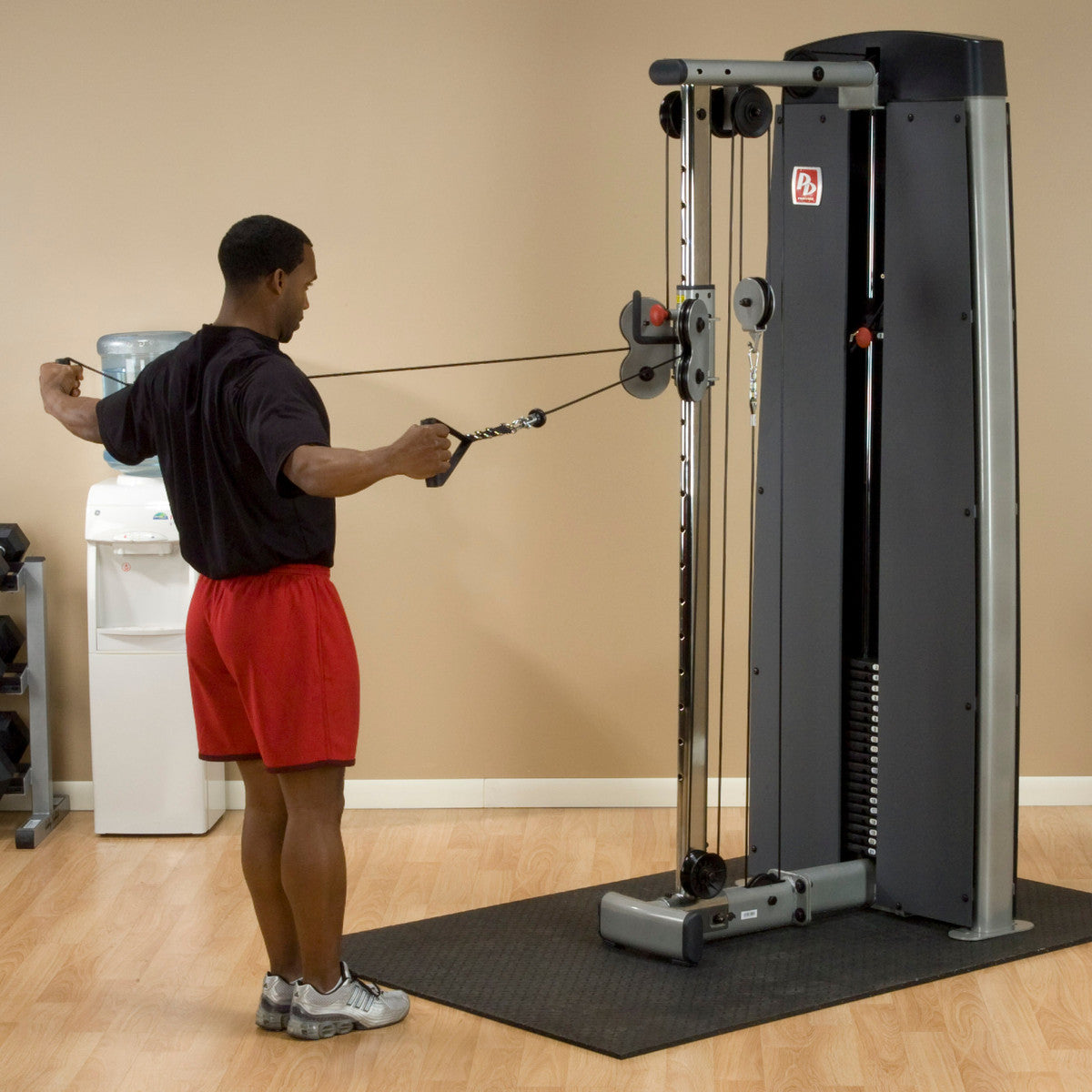 Body-Solid ProDual DPCC Cable Column Machine man exercising