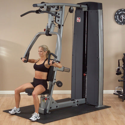 Body-Solid DPLSSF ProDual Press Arm Lat Machine woman exercising