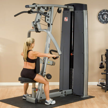 Body-Solid DPLSSF ProDual Press Arm Lat Machine woman exercising