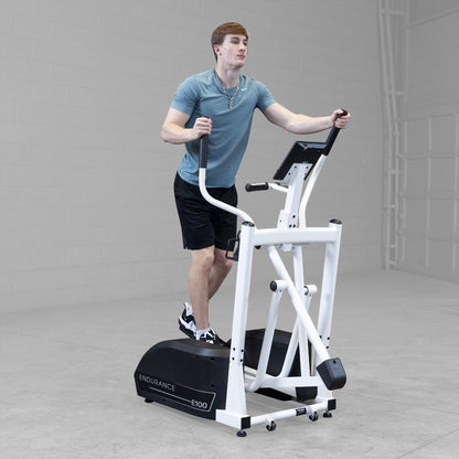 Body-Solid Endurance E100 Center Drive Elliptical Trainer man exercising
