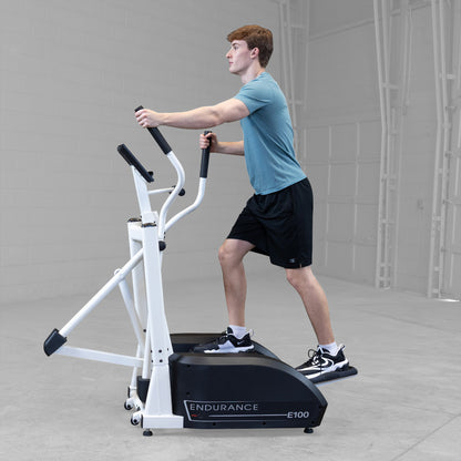 Body-Solid Endurance E100 Center Drive Elliptical Trainer man exercising