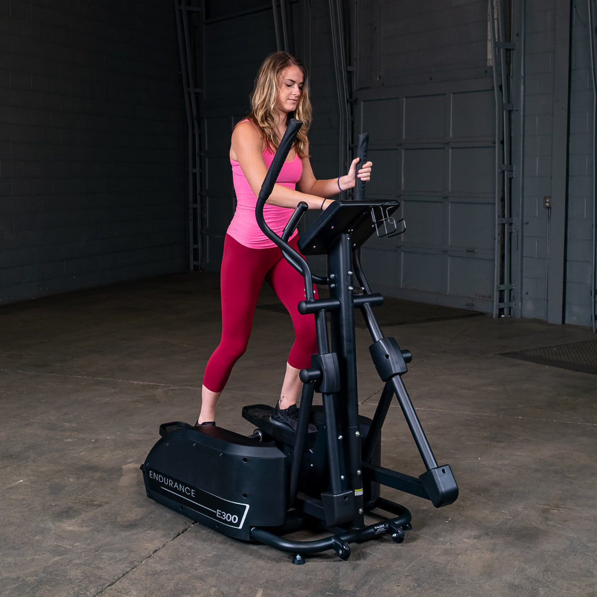 Body-Solid Endurance E300 Center Drive Elliptical woman exercising