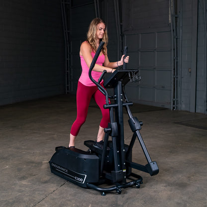 Body-Solid Endurance E300 Center Drive Elliptical woman exercising