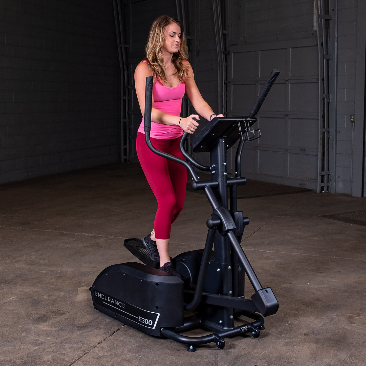 Body-Solid Endurance E300 Center Drive Elliptical woman exercising
