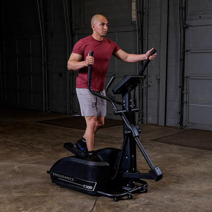 Body-Solid Endurance E300 Center Drive Elliptical man exercising