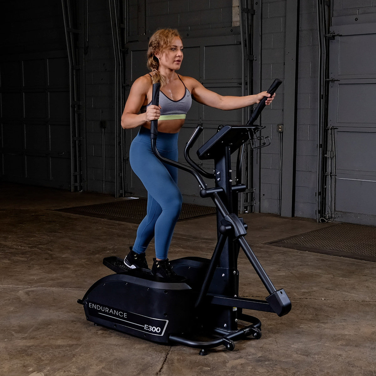 Body-Solid Endurance E300 Center Drive Elliptical woman exercising