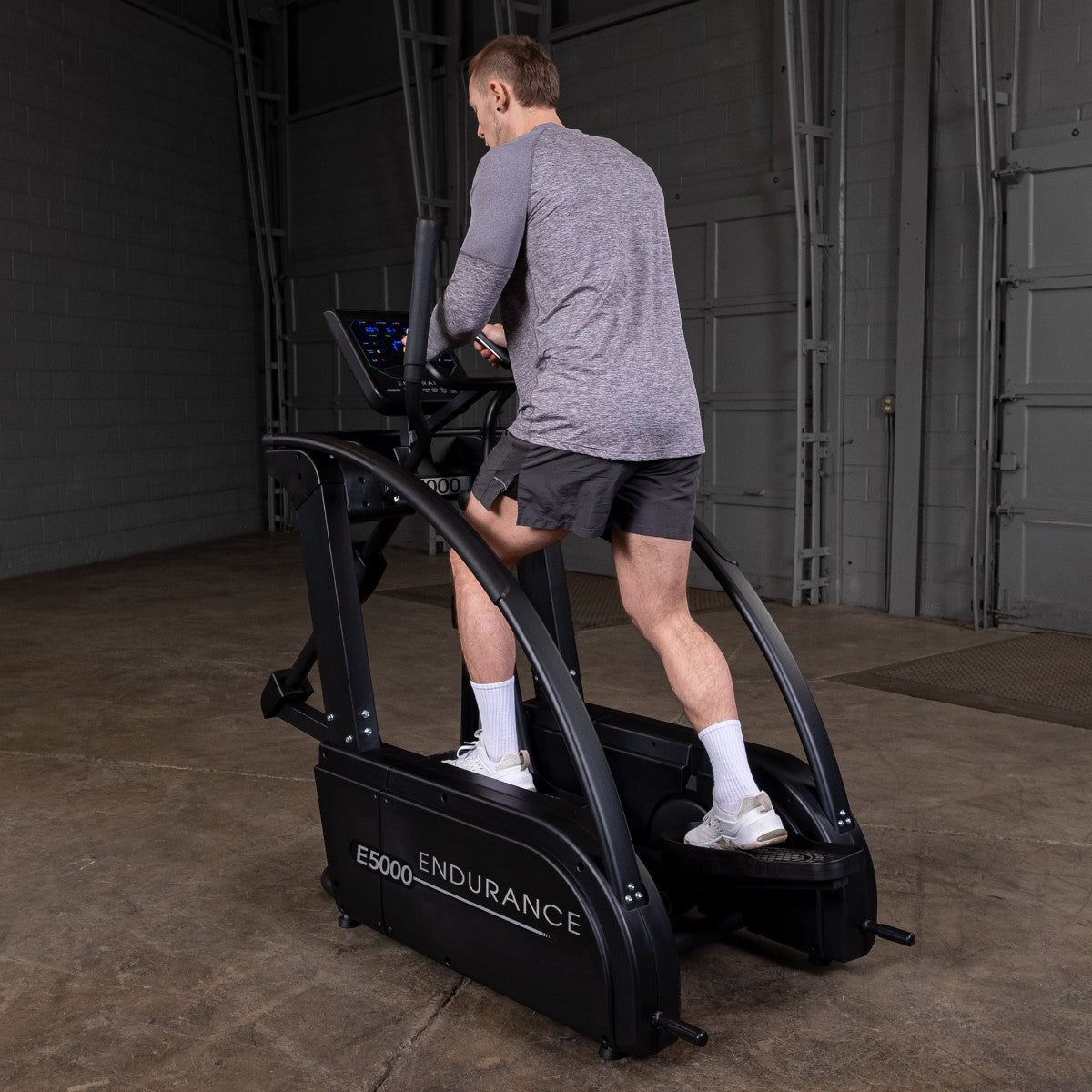 Body-Solid Endurance E5000 Premium Center Drive Elliptical man exercising