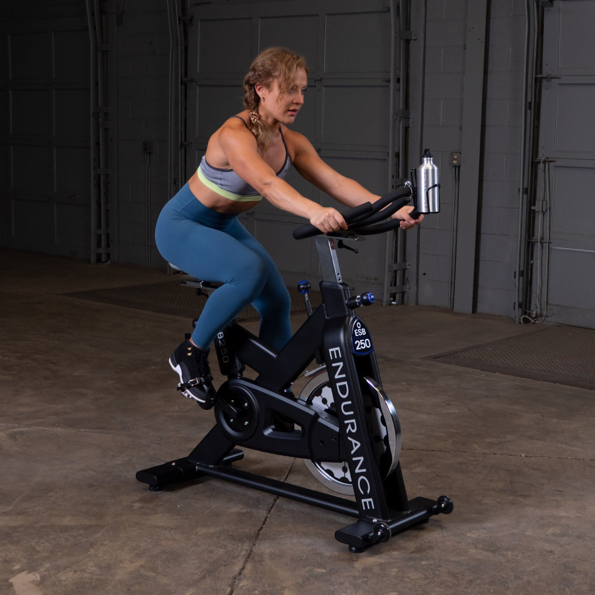 Body-Solid Endurance ESB250 Indoor Cycle woman exercising