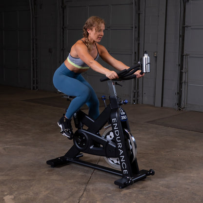 Body-Solid Endurance ESB250 Indoor Cycle woman exercising