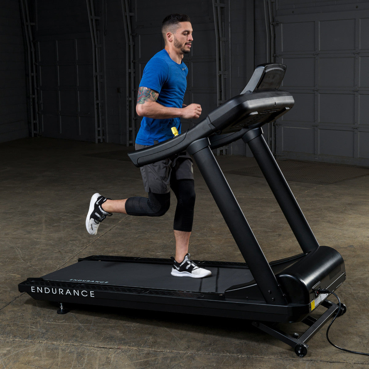 Body-Solid Endurance T150 Commercial Treadmill man running
