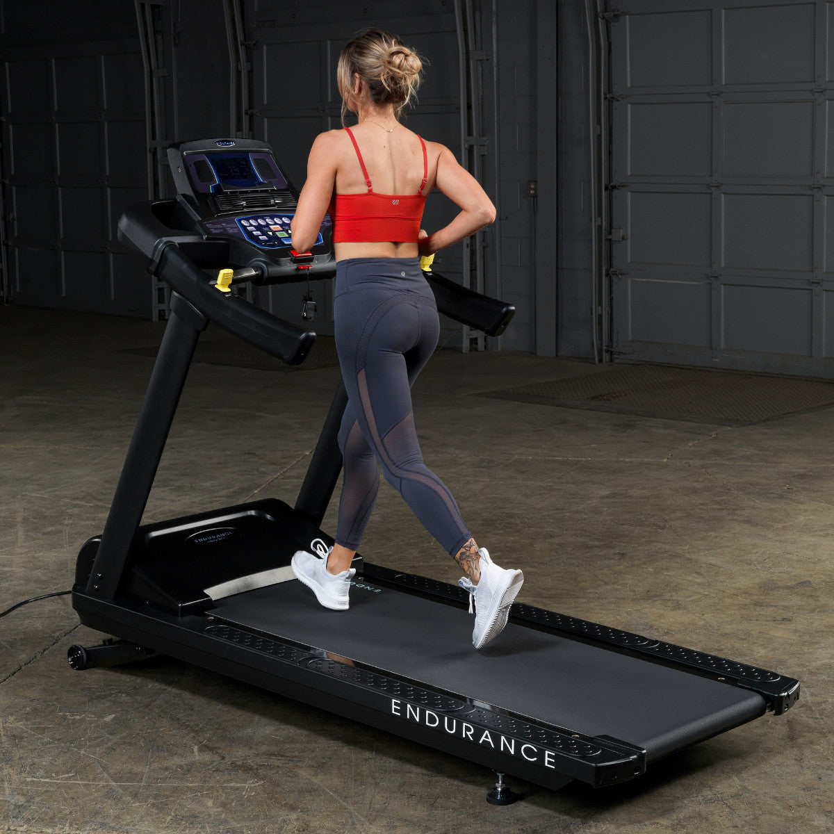 Body-Solid Endurance T150 Commercial Treadmill woman running
