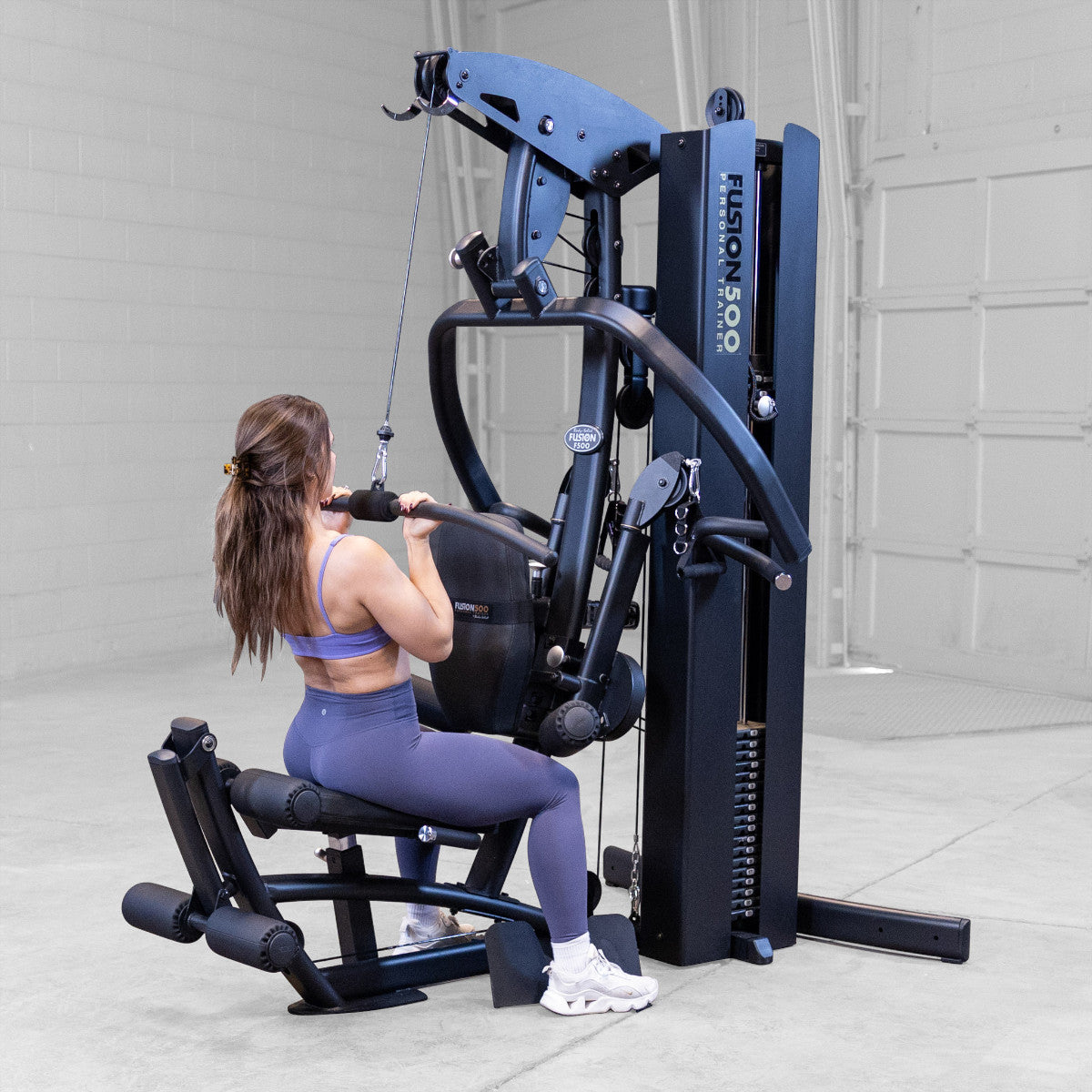 Body-Solid FUSION 500B Personal Trainer Gym with Functional Trainer Arms exercise