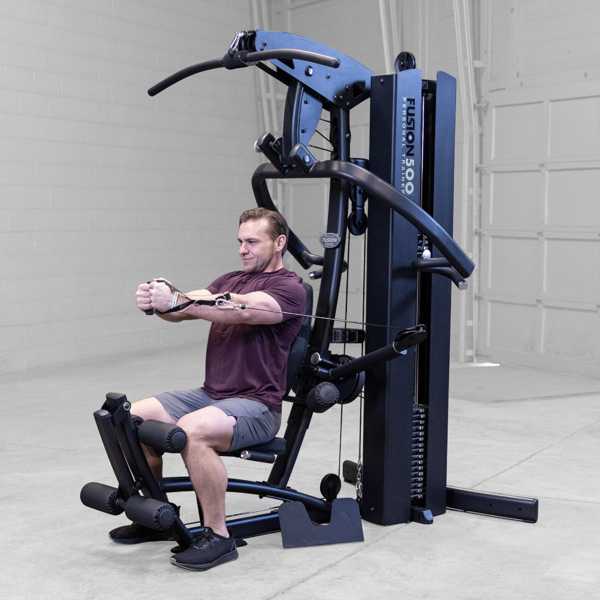 Body-Solid FUSION 500B Personal Trainer Gym with Functional Trainer Arms exercise
