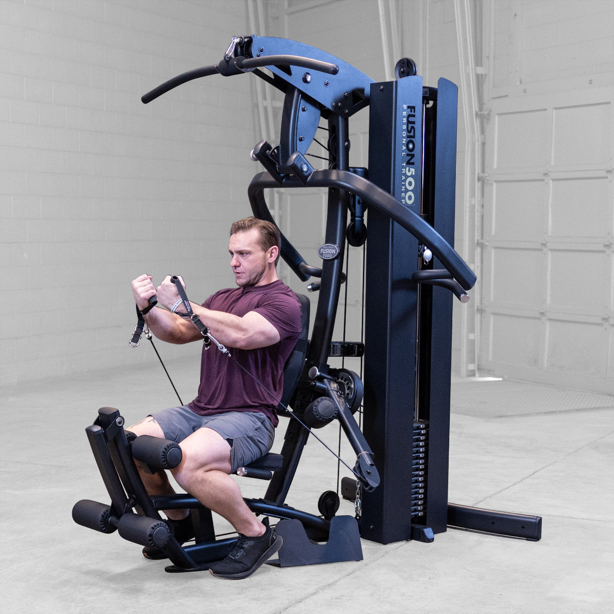 Body-Solid FUSION 500B Personal Trainer Gym with Functional Trainer Arms exercise