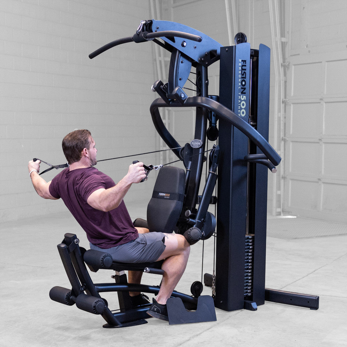 Body-Solid FUSION 500B Personal Trainer Gym with Functional Trainer Arms exercise