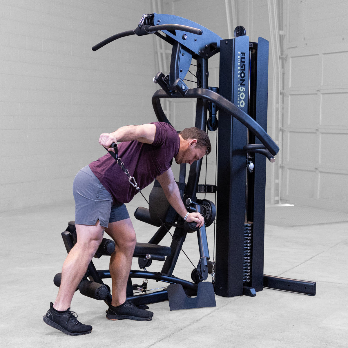 Body-Solid FUSION 500B Personal Trainer Gym with Functional Trainer Arms exercise