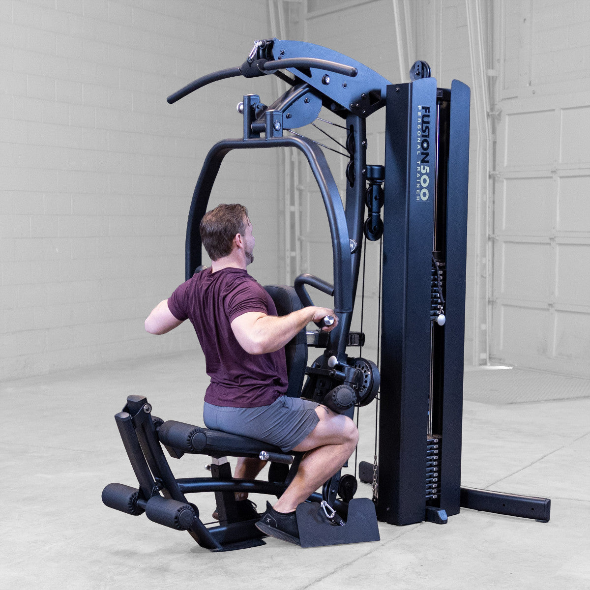 Body-Solid FUSION 500B Personal Trainer Gym with Functional Trainer Arms exercise