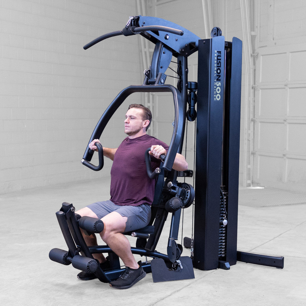 Body-Solid FUSION 500B Personal Trainer Gym with Functional Trainer Arms exercise