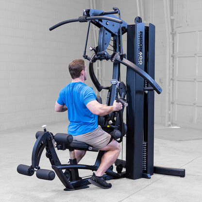 Body-Solid FUSION 600 Bi-Angular Gym with Functional Trainer Arms exercises on white background